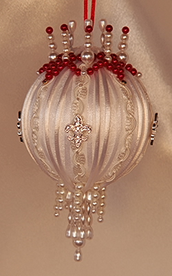 A Victorian Ornament resembling Angelina Jolie's gown worn at the Golden Globes in 2012 Pure Ivory and red 